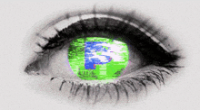 a close up of a person 's eye with a green screen in the center
