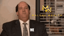 a man in a suit and tie says me in front of a window with blinds