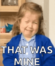 a little girl is crying with the words that was mine written on her face