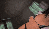 a woman in lingerie is laying on a bed