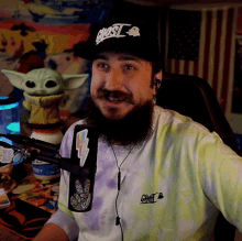 a man with a beard wears a hat that says ghost on it