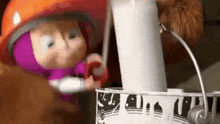 a cartoon character is standing next to a lamp and a bucket of milk .