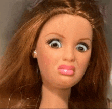 a close up of a barbie doll with a funny face
