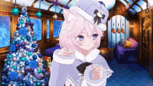 a girl with a cat ear is standing in front of a christmas tree and a sign that says 202