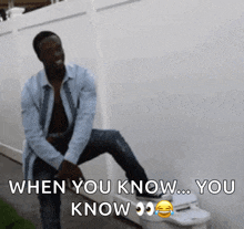 a man is sitting on a toilet with the words " when you know you know " above him