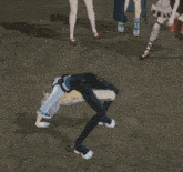 a group of anime characters are standing around a man who is on his knees
