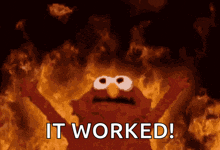 elmo is surrounded by flames with the words it worked