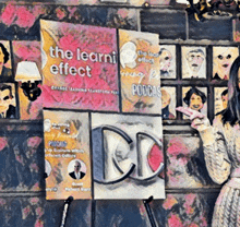 a woman is standing in front of a poster that says the learni effect