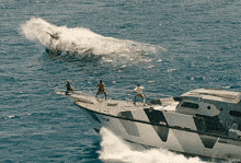 a boat with the letters scm on the side of it