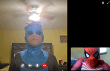 a man in a spiderman costume is on a video call with another person