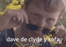 a man wearing sunglasses says " dave de clyde y sofa "