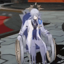 a man in a white suit is sitting in a wheelchair .