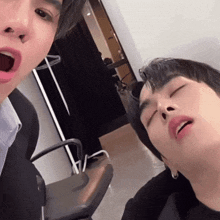 a man with his mouth open and his eyes closed