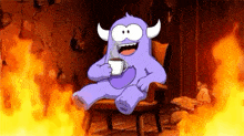 a purple monster with horns is sitting in a chair holding a cup of coffee .