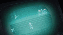 a tv screen shows a group of people on a stage