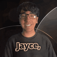 a young man wearing glasses and a black shirt with the name jayce on it
