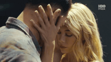 a close up of a man and woman 's faces with hbo max in the background