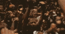 a pixelated image of a crowd of people with a rainbow of colors