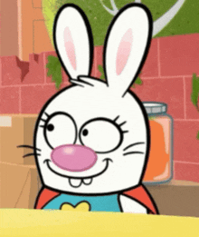 a cartoon rabbit with a pink nose and a red cape is smiling
