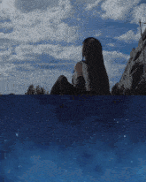 a woman is sitting on a rock looking at the stars