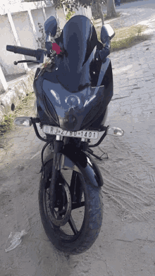 a black motorcycle with the license plate rj27bu1401