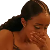 a woman covering her mouth with her hand and a ring on her finger