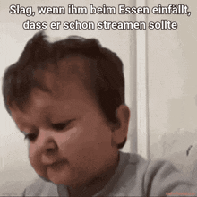 a baby making a sad face with the words slag wenn ihm beim essen einfall