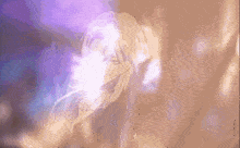 a close up of a woman 's face with a purple background