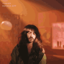 a man with long hair and a beard has his eyes closed and is made with reface app