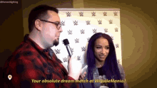 a woman with purple hair is being interviewed by a man with a microphone