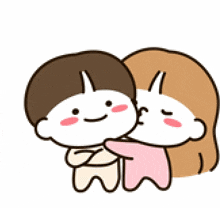a boy and a girl are hugging each other .