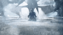 a man kneeling in the rain with a sword