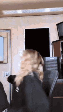 Spinning In Chair Anne Winters GIF - Spinning In Chair Anne Winters Holding Legs GIFs