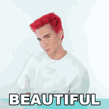 a man with red hair is next to a beautiful sign