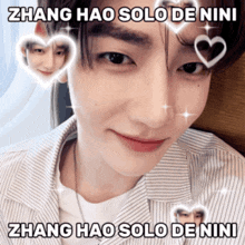 a picture of a boy with hearts around his face and the words zhang hao solo de nini