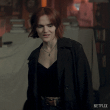 a woman in a black coat says who are you