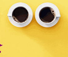 two cups of coffee on a yellow background with a devil wearing sunglasses in the foreground