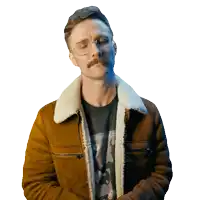 a man with glasses and a mustache is wearing a jacket with a fur collar