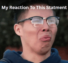 a man wearing glasses is making a funny face with the words my reaction to this statement above him