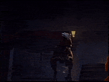 a dinosaur standing in a dark room with a light shining on it