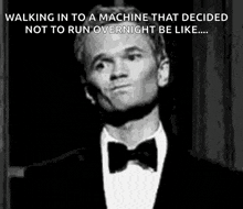 a man in a tuxedo is walking in to a machine that decided not to run overnight be like ..