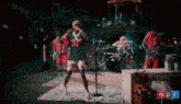 a group of people are performing on stage with npr written in the corner
