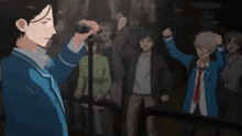 a man in a blue jacket is holding a microphone in front of a crowd of people
