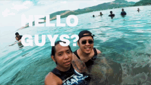a man and a woman in the water with the words hello guys on the bottom