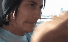 a close up of a person 's face with a blurred background