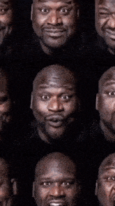 a bald man with a beard is making a funny face with his mouth open .