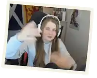 a woman wearing headphones is giving a thumbs up .