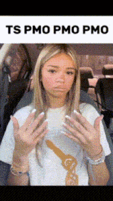 a girl is sitting in a car with her hands on her face and the words ts pmo pmo pmc above her