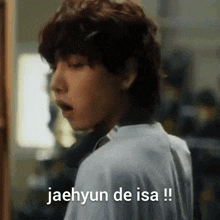 a close up of a person 's face with the words jaehyun de isa written on the bottom .