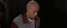 a person is standing on a wet floor holding a piece of paper in their hand .